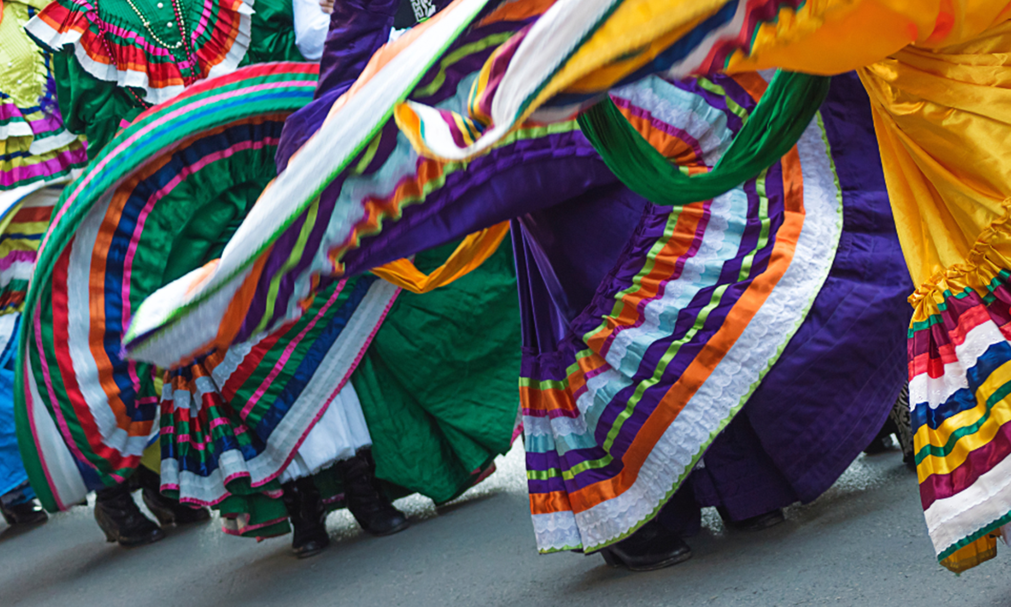 Close up of colorful folklorico dancer's dresses/skirts in motion.